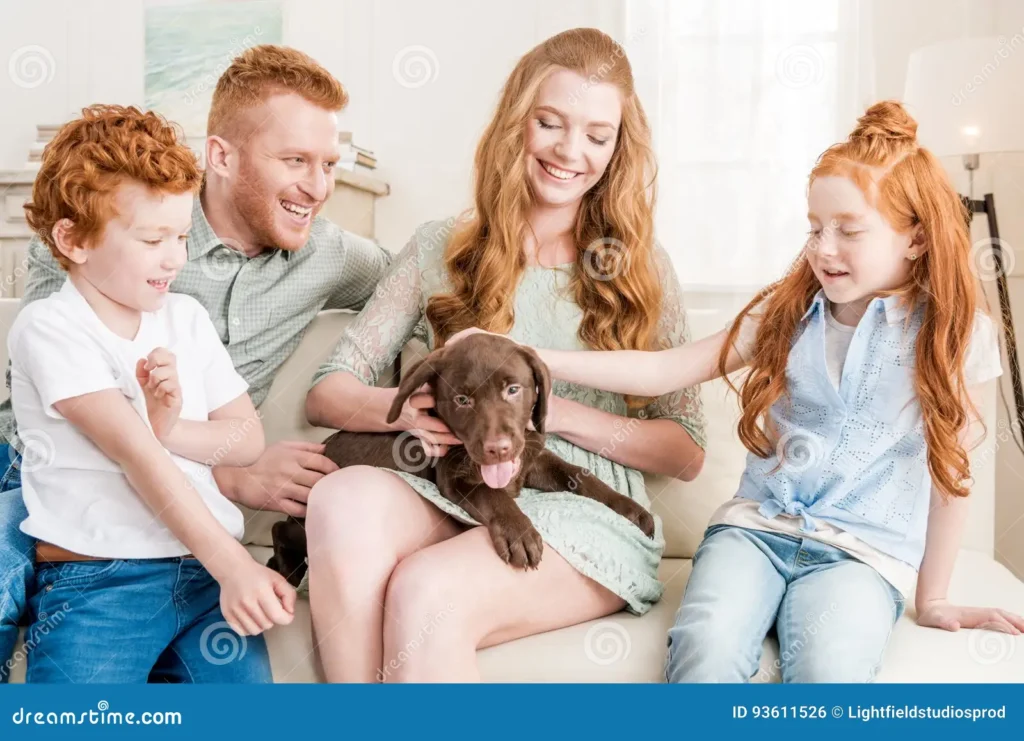 front view beautiful redhead family playing puppy home fun concept 93611526